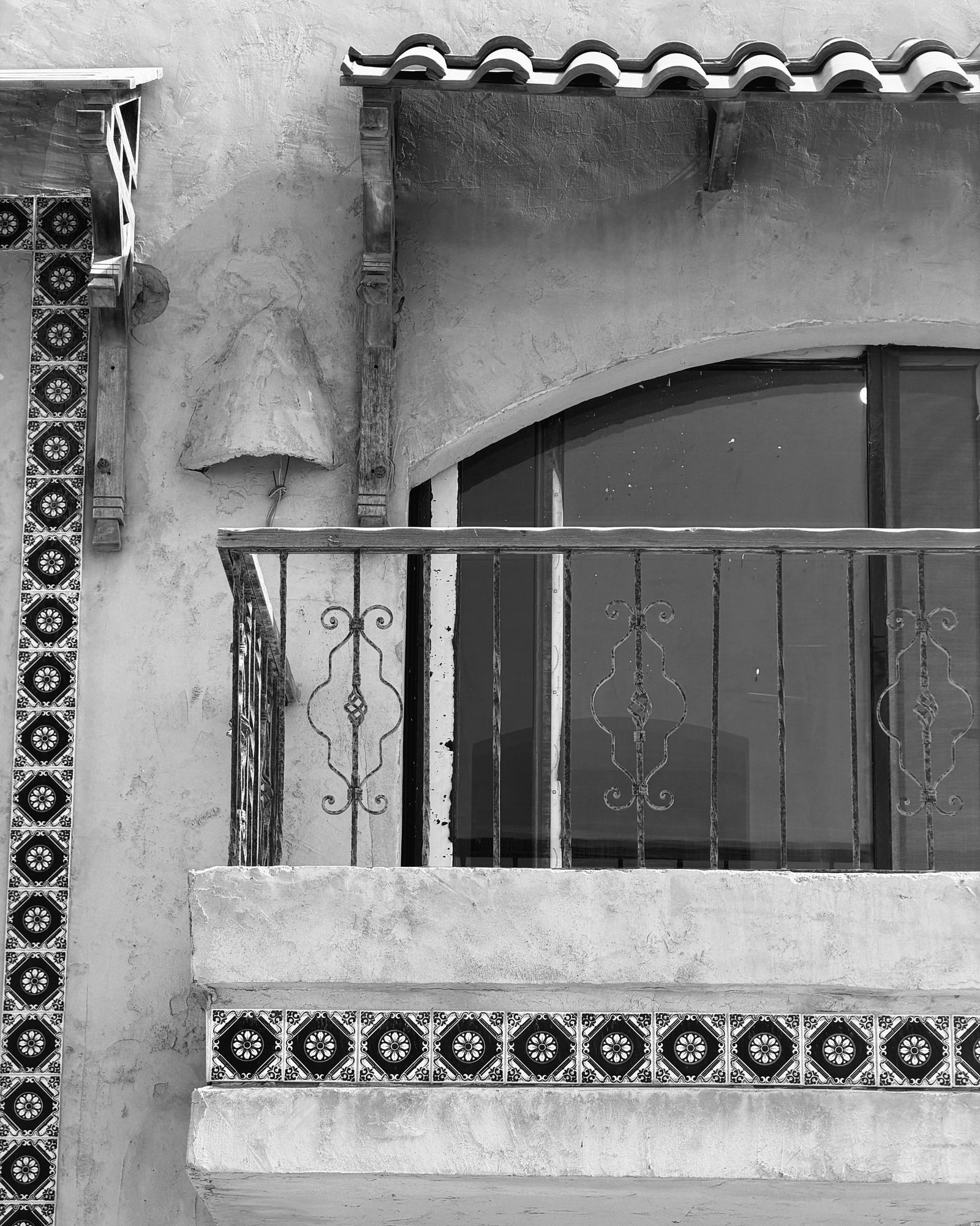 Arched balcony and tiled base