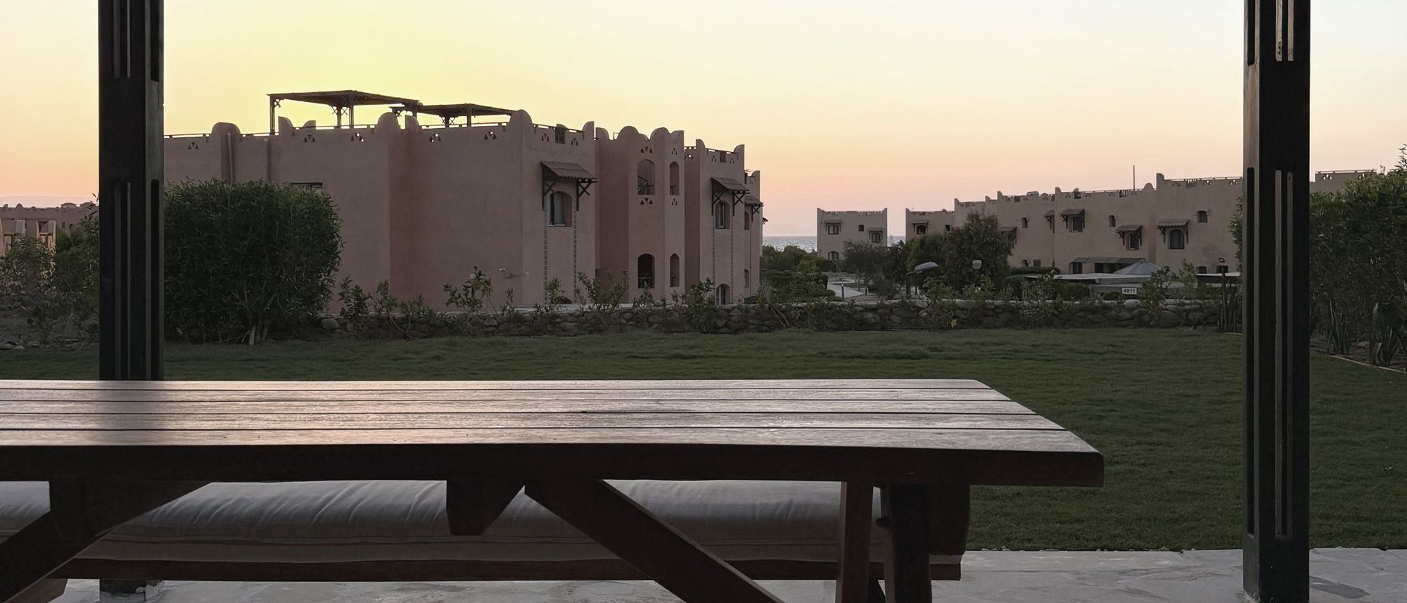 The shared outdoor table at La Hacienda Villa at sunset